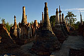 Inle Lake Myanmar. Indein, on the summit of a hill the  Shwe Inn Thein Paya a cluster of hundreds of ancient stupas. Many of them are ruined and overgrown with bushes. 